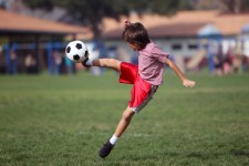 kid soccer kick