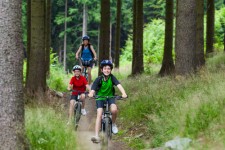 kids biking in woods