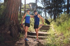 man woman stretching in woods